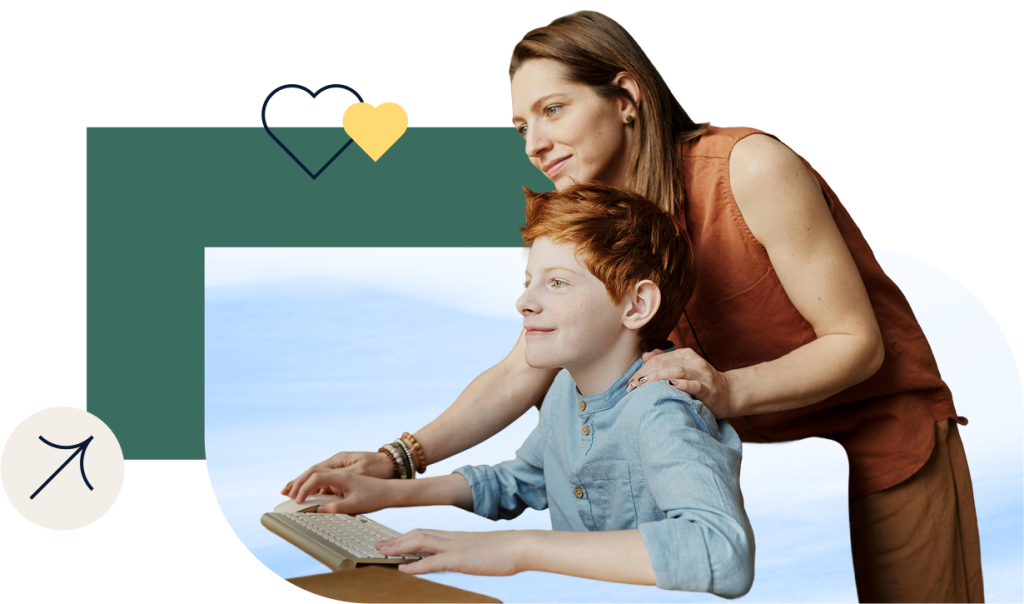 A woman standing behind a boy helping with with something on the computer